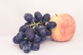 Apples and grapes on a white background