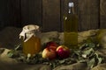 Apples with a jar of honey and a bottle of olive oil Royalty Free Stock Photo