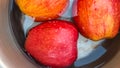 The Apples Kept Soaking In Water. Groups Fruits Different Angle Shot. Royalty Free Stock Photo