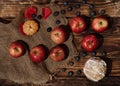 Apples, muffin, blueberry, tangerine on wooden background