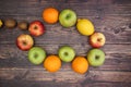 Apples oranges and lemons on the wooden table Royalty Free Stock Photo