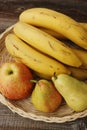 Apples pears and bananas on the table