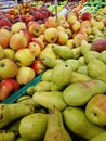 Apples and pears in plastic boxes in a store, close-up Royalty Free Stock Photo