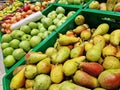 Apples and pears in plastic boxes in a store. Selling fruits Royalty Free Stock Photo