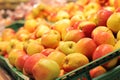 Apples in plastic boxes in a store, close-up. Ripe apples Royalty Free Stock Photo