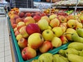 Apples in plastic boxes in a store, close-up. Ripe apples on sale Royalty Free Stock Photo