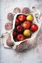 Apples starking in the mesh bag Royalty Free Stock Photo