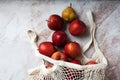 Apples starking in the mesh bag Royalty Free Stock Photo