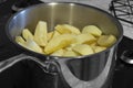 Apples stewing in a saucepan on a hob stove. Royalty Free Stock Photo