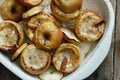 Apples topped nuts honey cinnamon baking wooden table top view Royalty Free Stock Photo