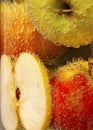 Apples in a vase of soda water, bubbles and water Royalty Free Stock Photo