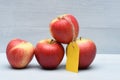 Apples with yellow tag Royalty Free Stock Photo