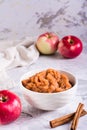 Applesauce with cinnamon in a bowl and fresh fruit on the table. Organic food. Vertical view Royalty Free Stock Photo