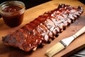 applewood smoked pork ribs, barbecue sauce, and a basting brush Royalty Free Stock Photo