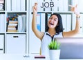 Happy girl holding a poster with the inscription work. The applicant was interviewed and got a job in the office. Royalty Free Stock Photo