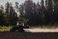 Application of chemical fertilizers to crops by spraying, which is carried out by an agricultural tractor with built-in