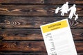 Application form for adopt child on wooden background top view mock up