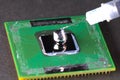 Application of liquid metal to processor to install a cooling system Royalty Free Stock Photo