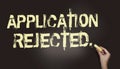 Application rejected written with chalk on blackboard. Concept of denied education application, rejection to injury claim