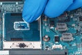 Application of thermal paste on the laptop processor chip for high-quality cooling Royalty Free Stock Photo