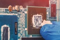 Application of thermal paste on the laptop processor chip for high-quality cooling Royalty Free Stock Photo