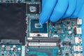 Application of thermal paste on the laptop processor chip for high-quality cooling Royalty Free Stock Photo
