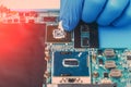 Application of thermal paste on the laptop processor chip for high-quality cooling Royalty Free Stock Photo