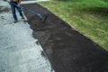 Application of Top soil at new sidewalk Royalty Free Stock Photo