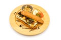 Applied Korea and America hotdog breakfast style with breef pork cheese and vegetable on the circle wood plate in studiolight Royalty Free Stock Photo