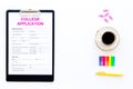Apply college. Empty college application form near coffee cup and stationery on white background top view space for text