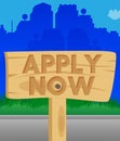 Apply now text on Wooden sign.