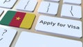 APPLY FOR VISA text and flag of Cameroon on the buttons on the computer keyboard. Conceptual 3D rendering Royalty Free Stock Photo