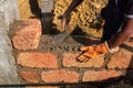 Applying Cement Mortar While Building Brick Wall Royalty Free Stock Photo