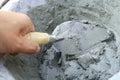 Applying construction trowel in wet cement Royalty Free Stock Photo