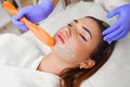 Applying cosmetic gel on the face patient. Royalty Free Stock Photo