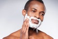 Applying cream on face. Royalty Free Stock Photo