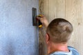 Applying decorative mosaic plaster on the wall. Royalty Free Stock Photo