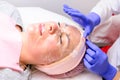 Applying a film mask on the face to steam and open pores, visit the spa