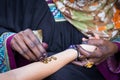 Applying henna for a temporary tattoo Royalty Free Stock Photo