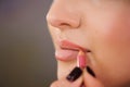 Applying lips contour. Closeup Of Woman Face. Beauty Cosmetics, Makeup Concept.