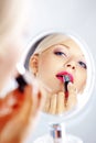 Applying lipstick Royalty Free Stock Photo