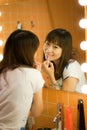 Applying makeup Royalty Free Stock Photo