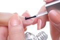 Applying manicure, clear enamel