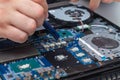 Applying a new thermal paste to the laptop cooling system from a tube