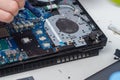 Applying a new thermal paste to the laptop cooling system from a tube