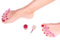 Applying pedicure to woman`s feet with red toenails, in pink toe separators, on white isolated background.