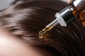 applying scalp serum for healthier hair follicles