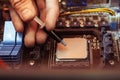 Applying thermal paste on the processor Royalty Free Stock Photo