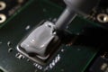 Applying thermal paste to the processor Royalty Free Stock Photo
