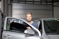 Applying tinting foil onto a car window Royalty Free Stock Photo